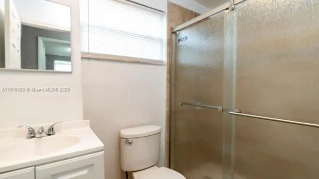 a view of a room with rack on the wall and a window