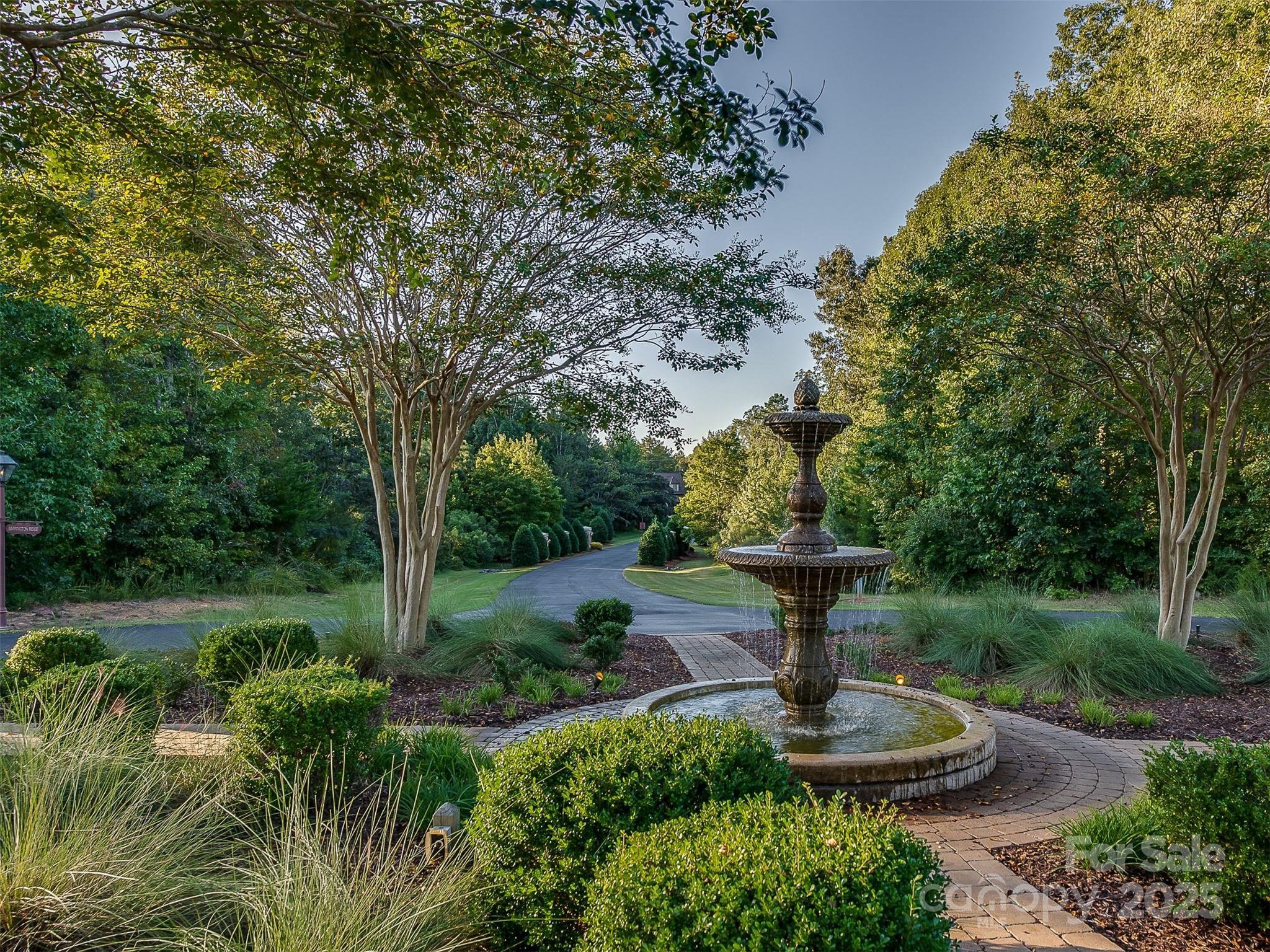 5248 Winding Grove Way, Unit 61 Fort Mill, SC 29707 - Photo 6 of 6 a view of a garden with a fountain