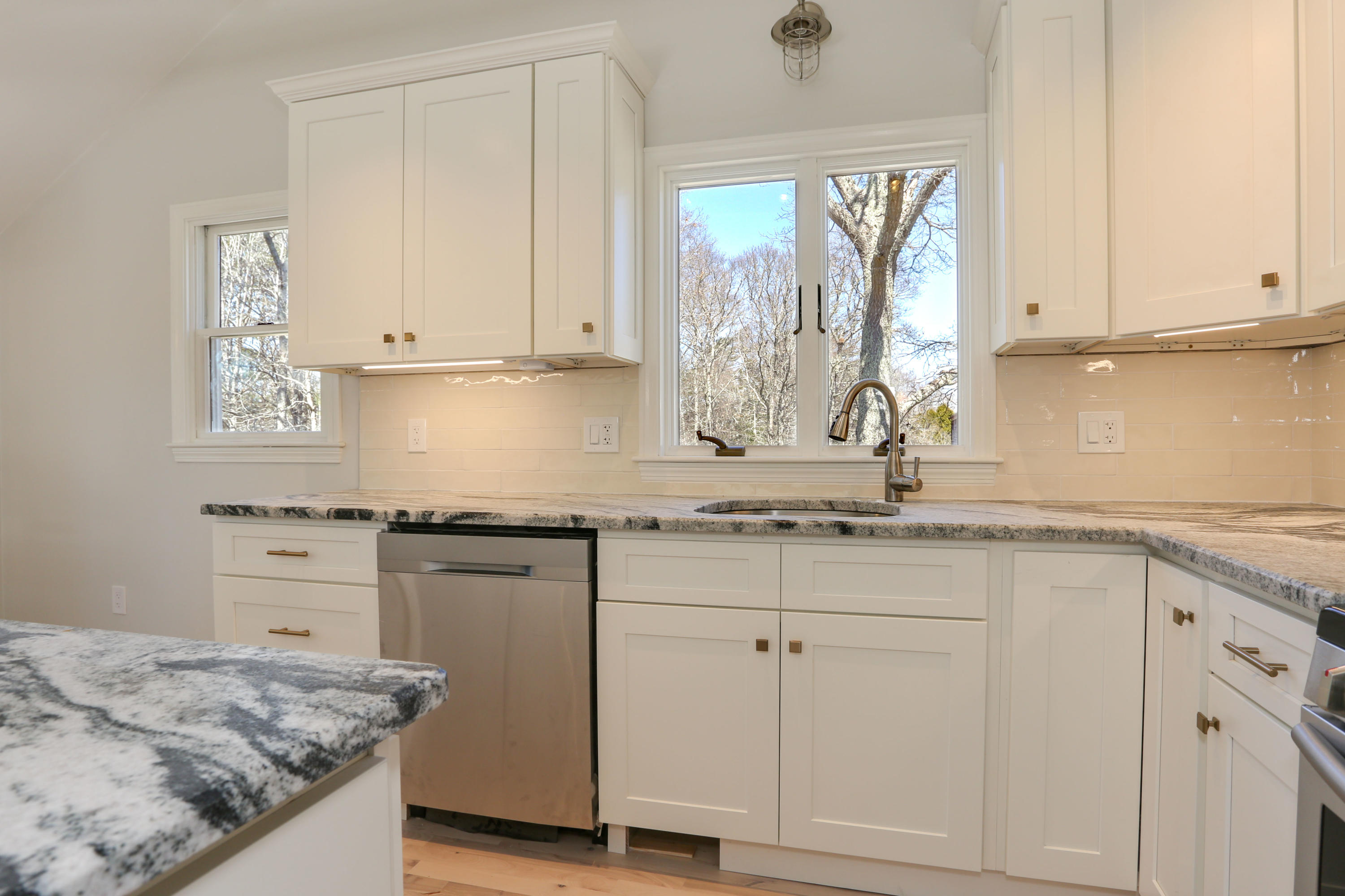 21 Cove Road Forestdale, MA 02644 - Photo 11 of 29 a kitchen with granite countertop white cabinets and a sink