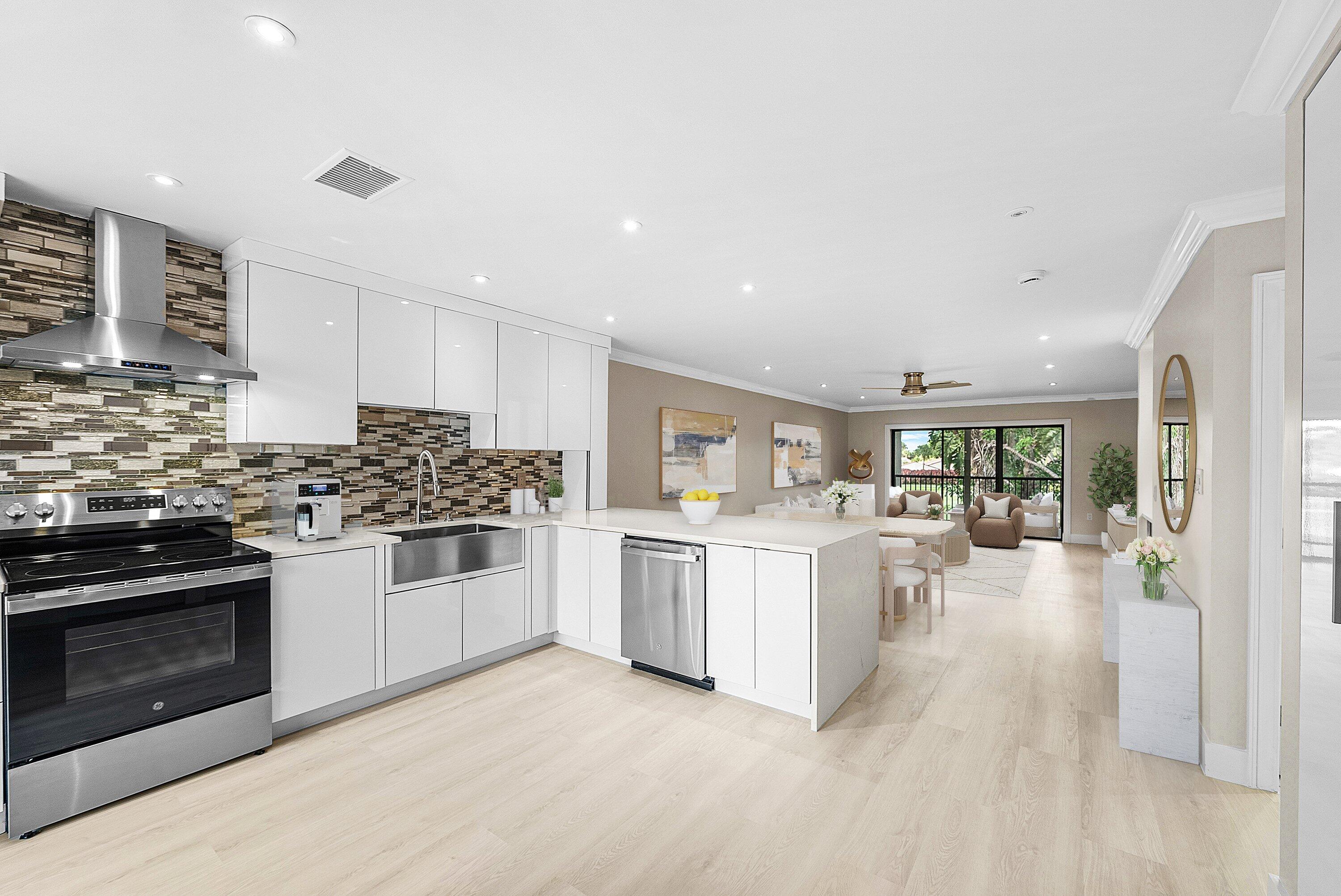 a kitchen with sink and stove top oven
