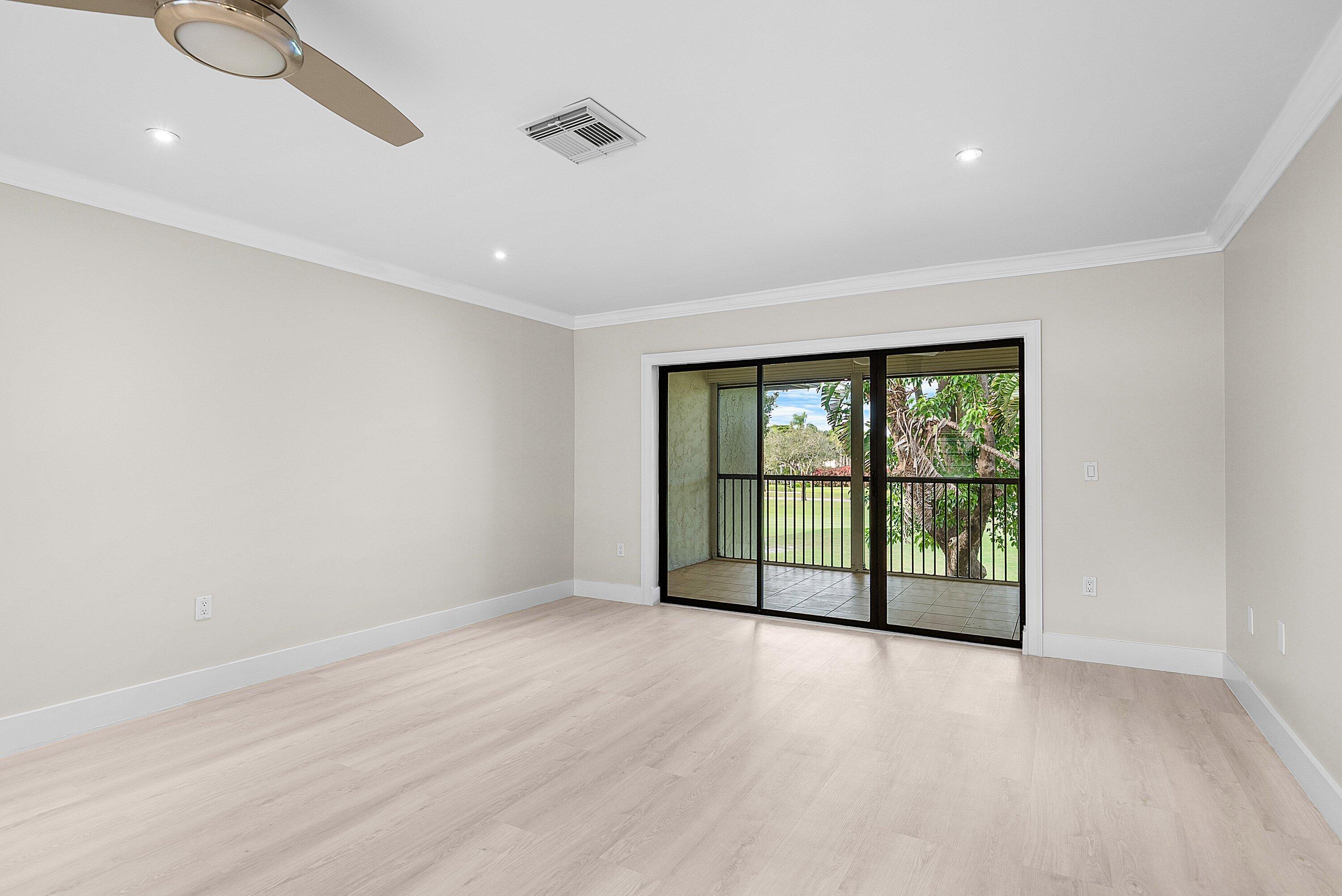 18 Stratford Drive East, Unit F Boynton Beach, FL 33436 - Photo 21 of 54 a view of an empty room with a window