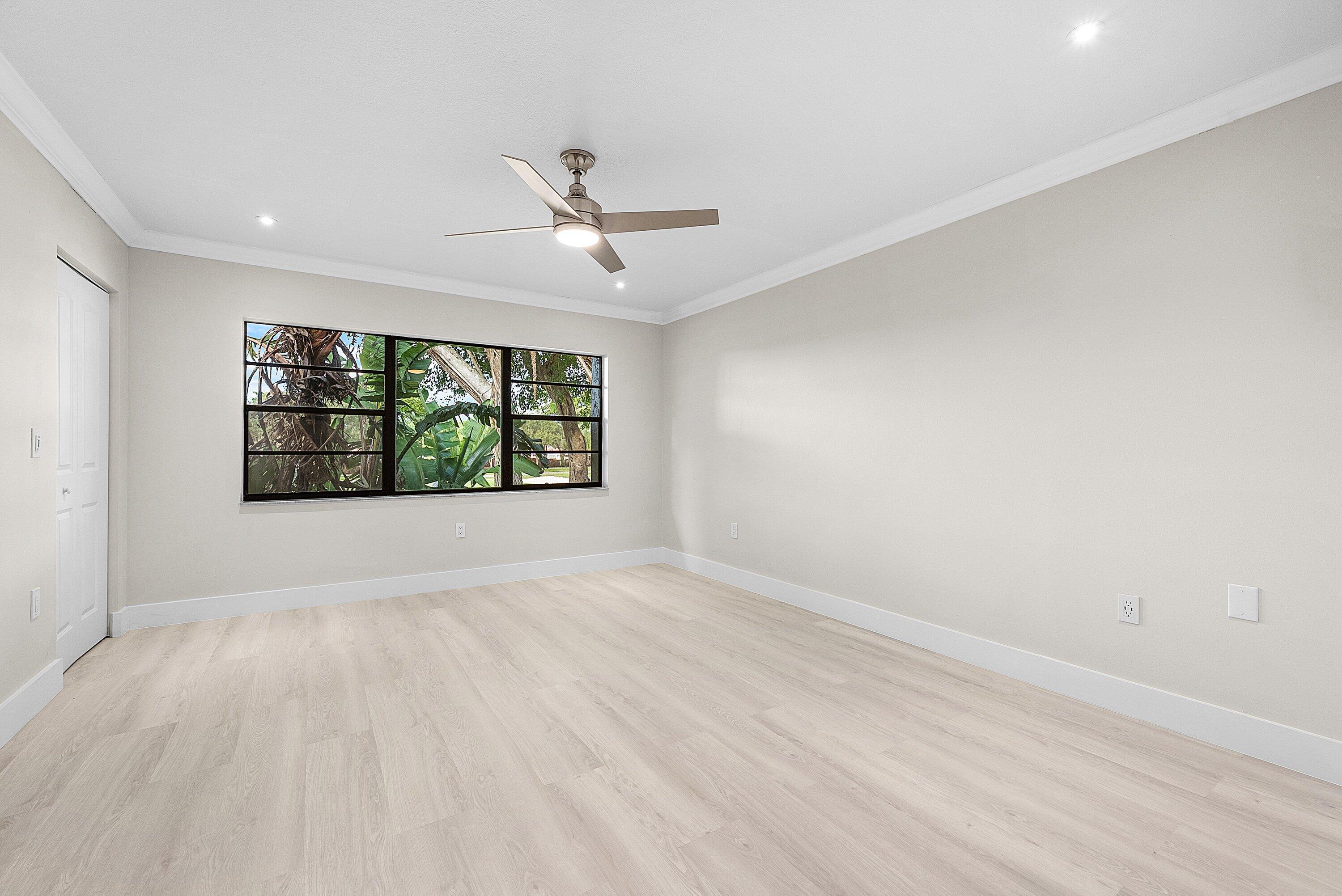 18 Stratford Drive East, Unit F Boynton Beach, FL 33436 - Photo 26 of 54 a view of an empty room with a window