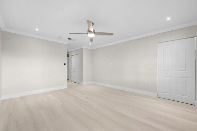 a view of closet area with empty racks