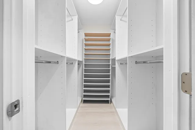 a view of a hallway with washer and dryer