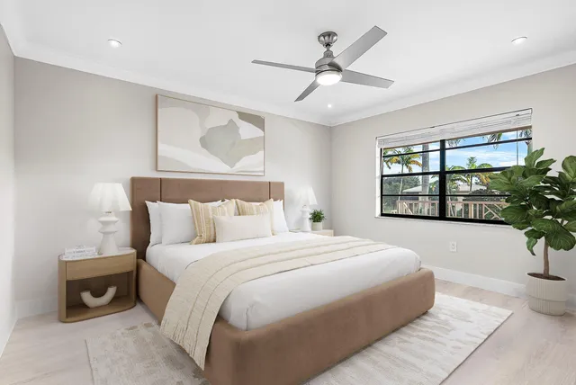 a bedroom with a large bed and a window