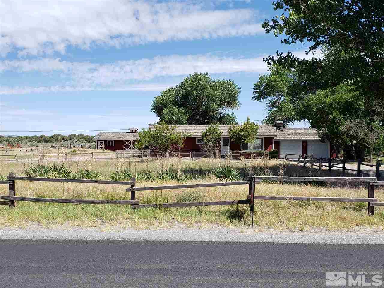 2355 Rice Road Fallon, NV 89406 - Photo 1 of 22 a view of a lake with a house in the background