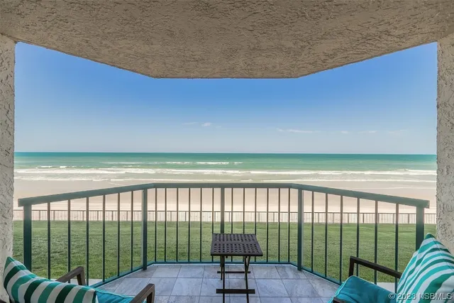 a view of a swimming pool and a patio
