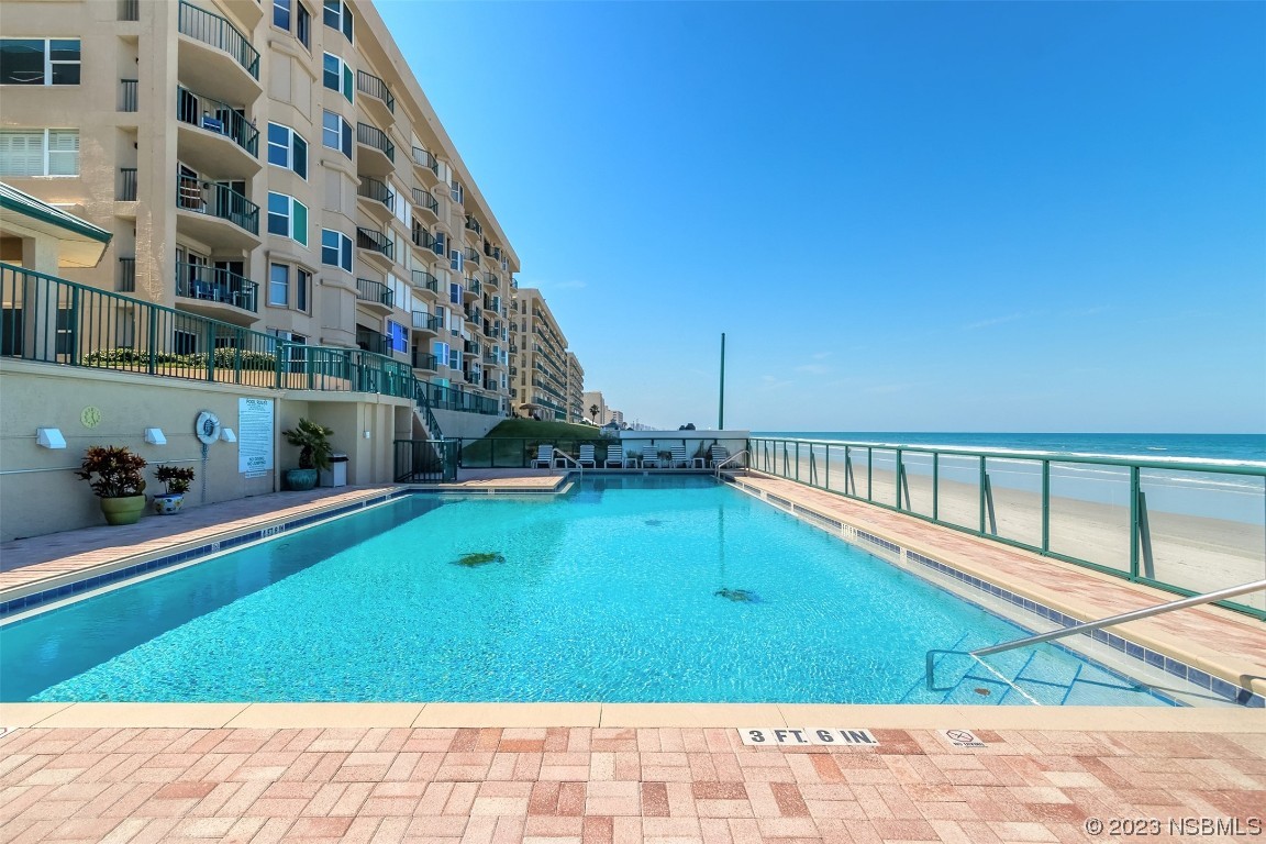 4545 South Atlantic Avenue, Unit 3204 Ponce Inlet, FL 32127 - Photo 15 of 58 a view of an swimming pool with an outdoor seating