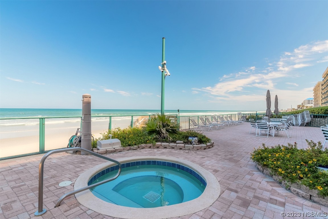 4545 South Atlantic Avenue, Unit 3204 Ponce Inlet, FL 32127 - Photo 16 of 58 a view of a swimming pool with a lounge chairs