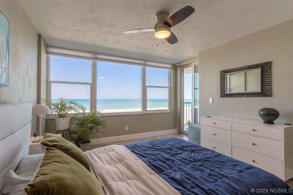 4545 South Atlantic Avenue, Unit 3204 Ponce Inlet, FL 32127 - Photo 20 of 58 a bedroom with a large bed and a window