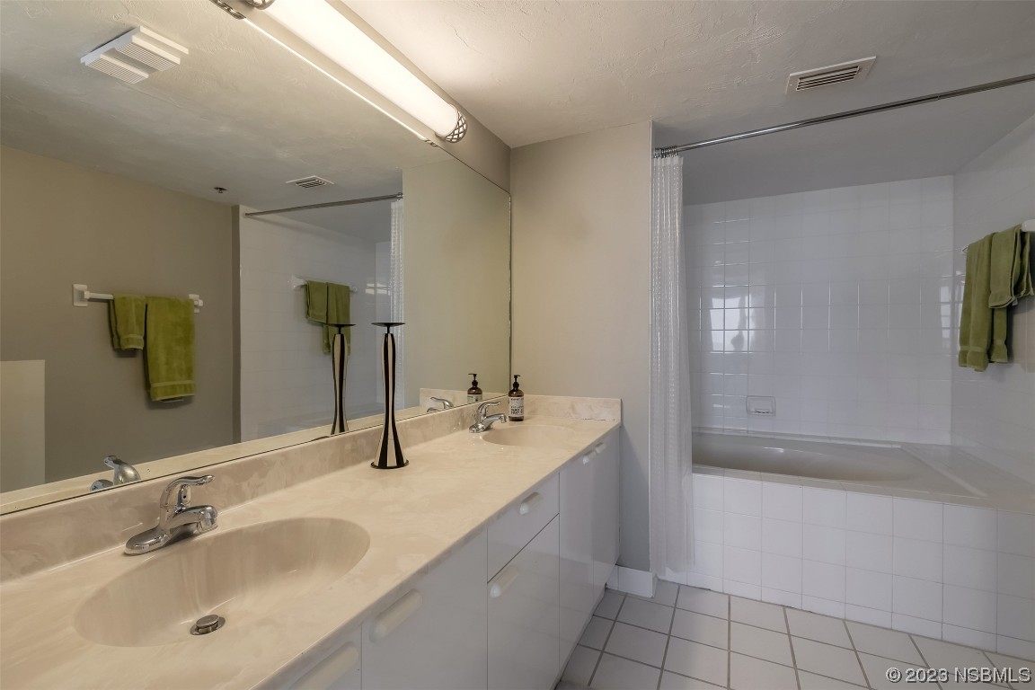 4545 South Atlantic Avenue, Unit 3204 Ponce Inlet, FL 32127 - Photo 21 of 58 a bathroom with a sink and a mirror