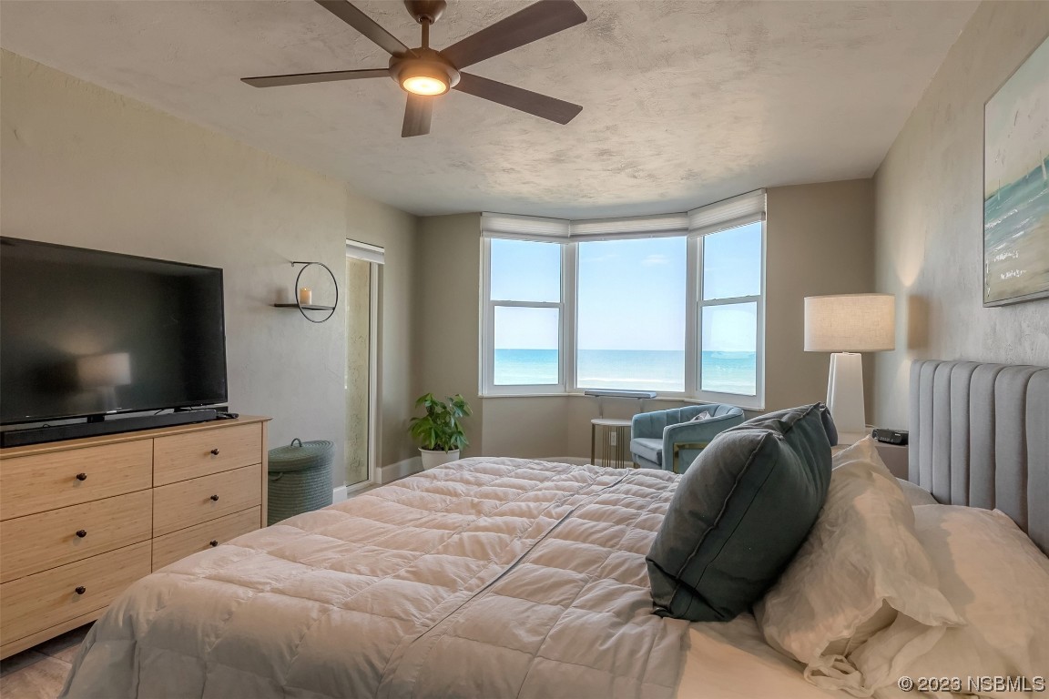 4545 South Atlantic Avenue, Unit 3204 Ponce Inlet, FL 32127 - Photo 27 of 58 a bedroom with a bed and a flat screen tv