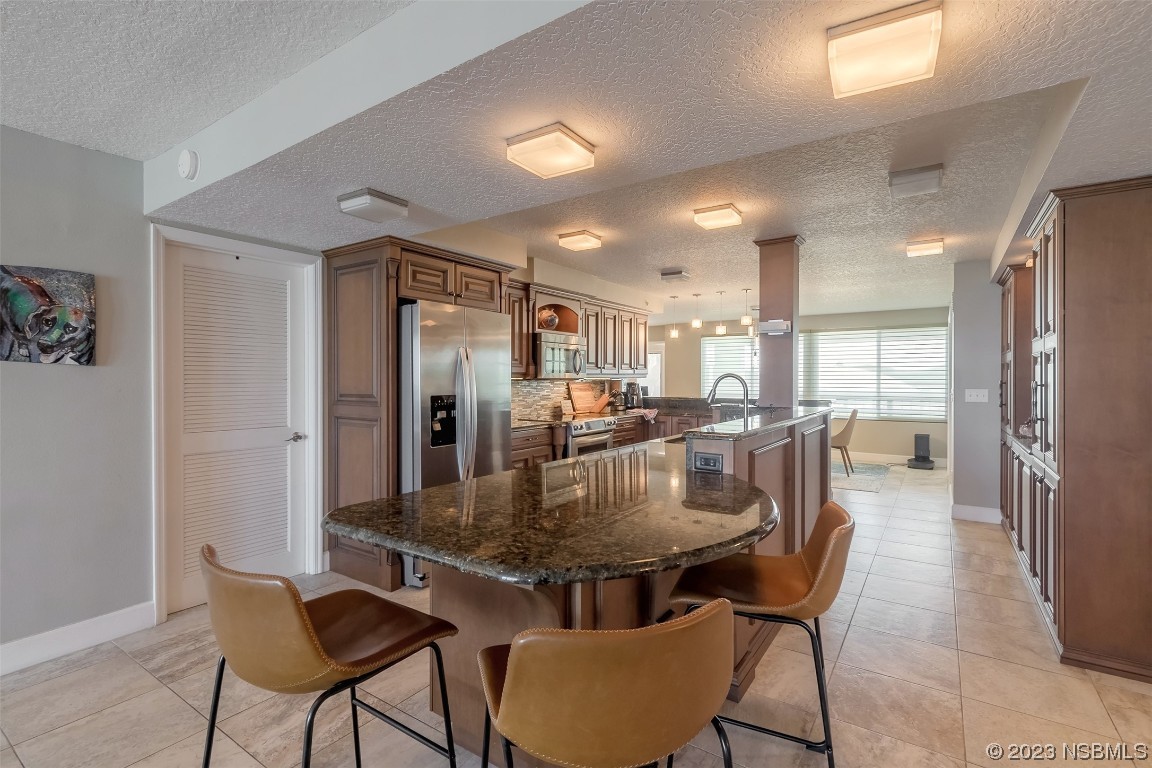 4545 South Atlantic Avenue, Unit 3204 Ponce Inlet, FL 32127 - Photo 36 of 58 a view of a dining room with furniture
