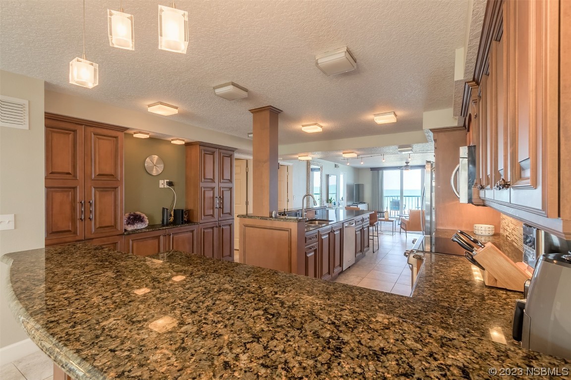 4545 South Atlantic Avenue, Unit 3204 Ponce Inlet, FL 32127 - Photo 40 of 58 a large room with lots of tables a large window and chairs