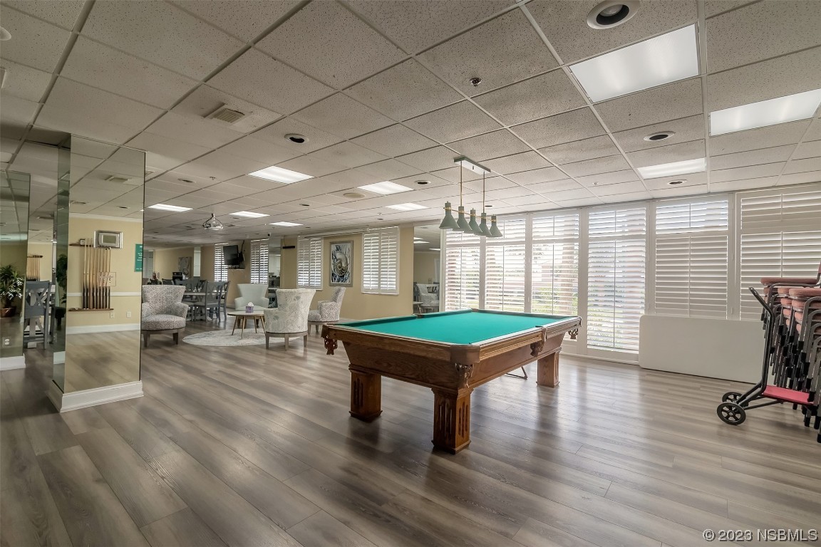 4545 South Atlantic Avenue, Unit 3204 Ponce Inlet, FL 32127 - Photo 4 of 58 a room with furniture pool table wooden floor and windows