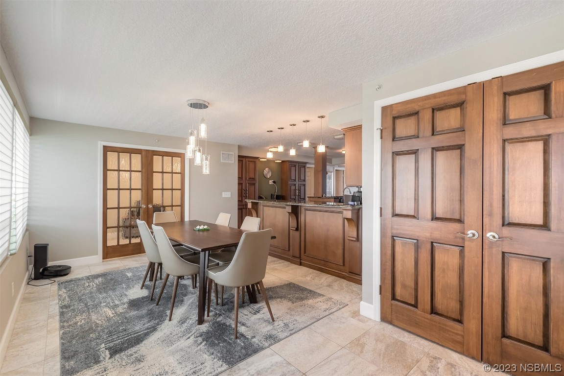 4545 South Atlantic Avenue, Unit 3204 Ponce Inlet, FL 32127 - Photo 45 of 58 a dining room with furniture and window