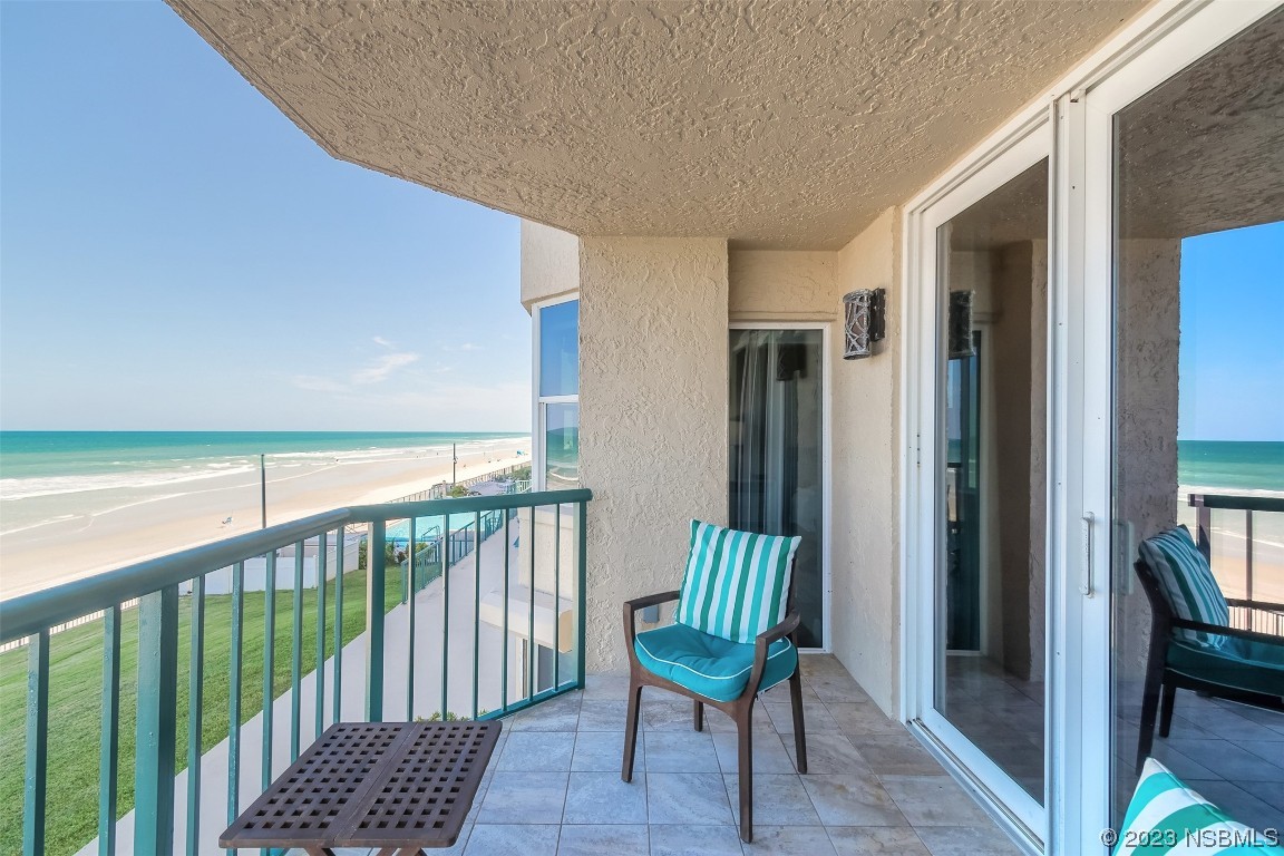 4545 South Atlantic Avenue, Unit 3204 Ponce Inlet, FL 32127 - Photo 49 of 58 a view of a balcony with furniture