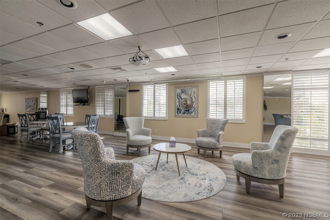 4545 South Atlantic Avenue, Unit 3204 Ponce Inlet, FL 32127 - Photo 5 of 58 a living room with furniture and wooden floor