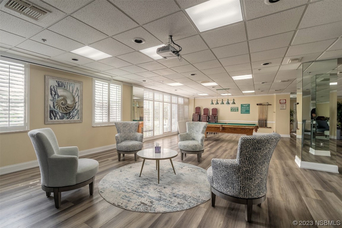 4545 South Atlantic Avenue, Unit 3204 Ponce Inlet, FL 32127 - Photo 6 of 58 a living room with furniture and a table