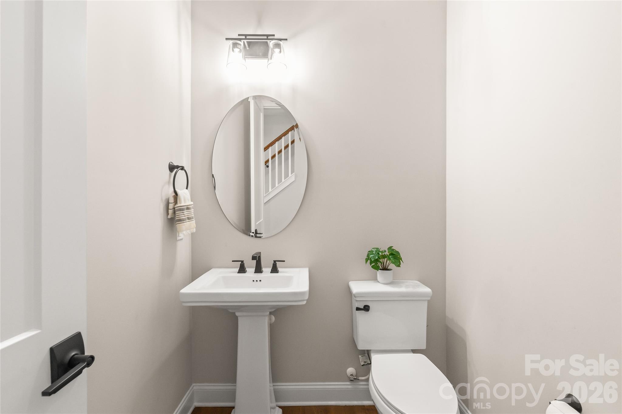 3213 Timber Run Lane Maiden, NC 28650 - Photo 34 of 47 a bathroom with a sink a toilet and a mirror