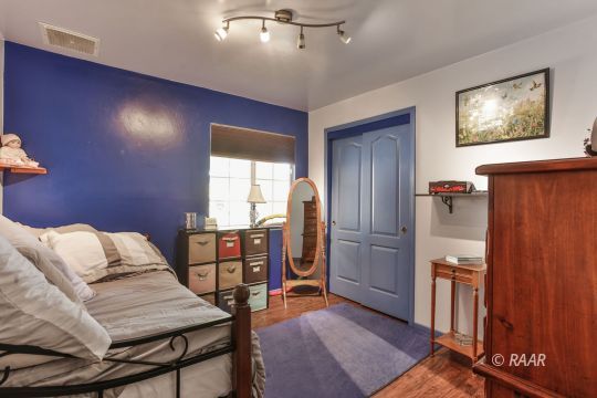 424 Mavis Court Ridgecrest, CA 93555 - Photo 15 of 32 a bedroom with furniture and a window