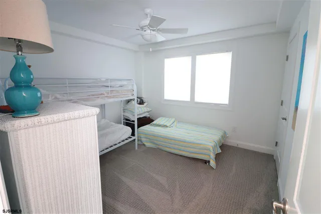 a bathroom with a toilet sink and shower