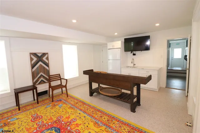 a view of a dining room with furniture window and outside view