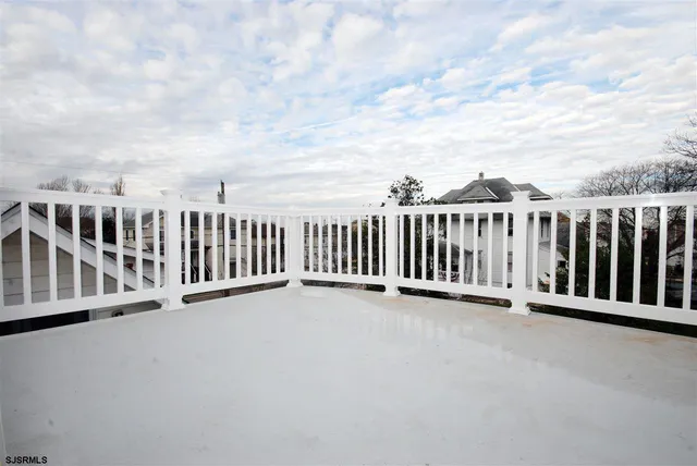 a view of a balcony with city view