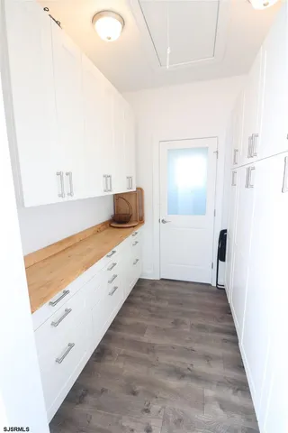 a spacious bedroom with a bed and a couch