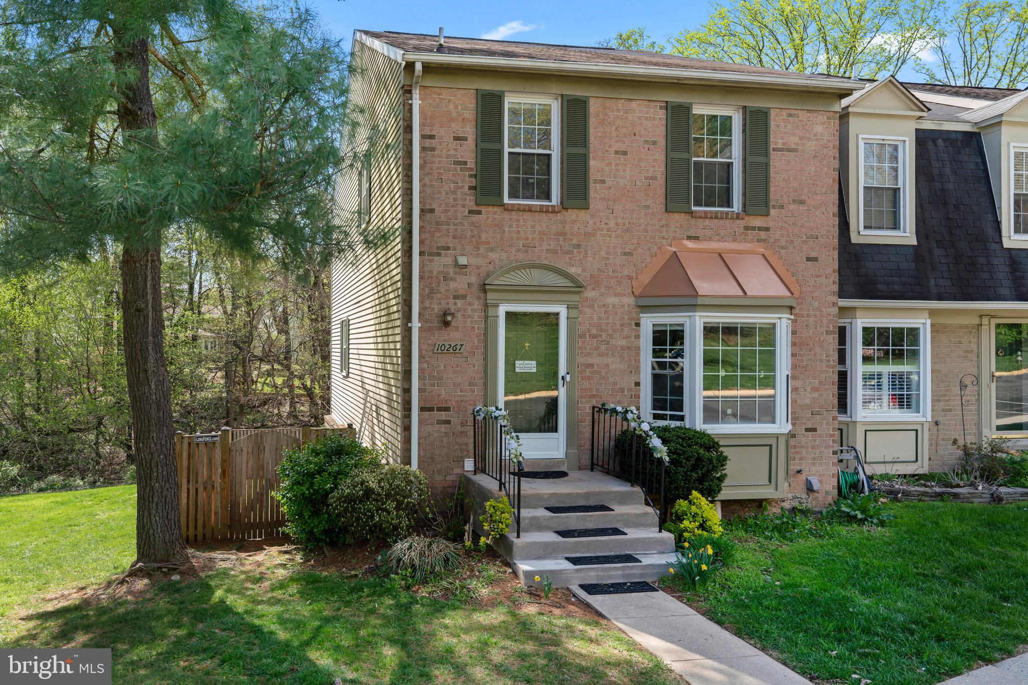 10267 Green Holly Terrace Silver Spring, MD 20902 - Photo 1 of 52 a view of a house with a yard and plants