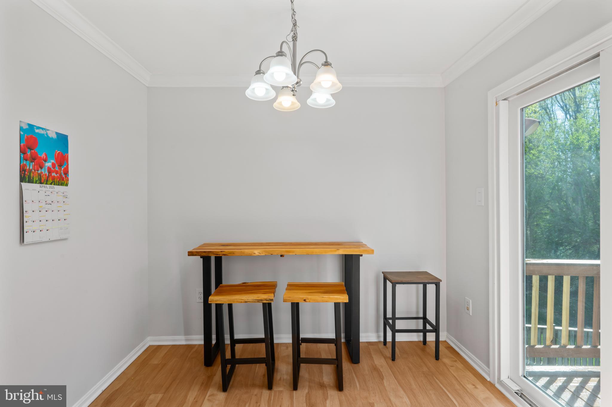 10267 Green Holly Terrace Silver Spring, MD 20902 - Photo 12 of 52 a view of a dining room with furniture and wooden floor