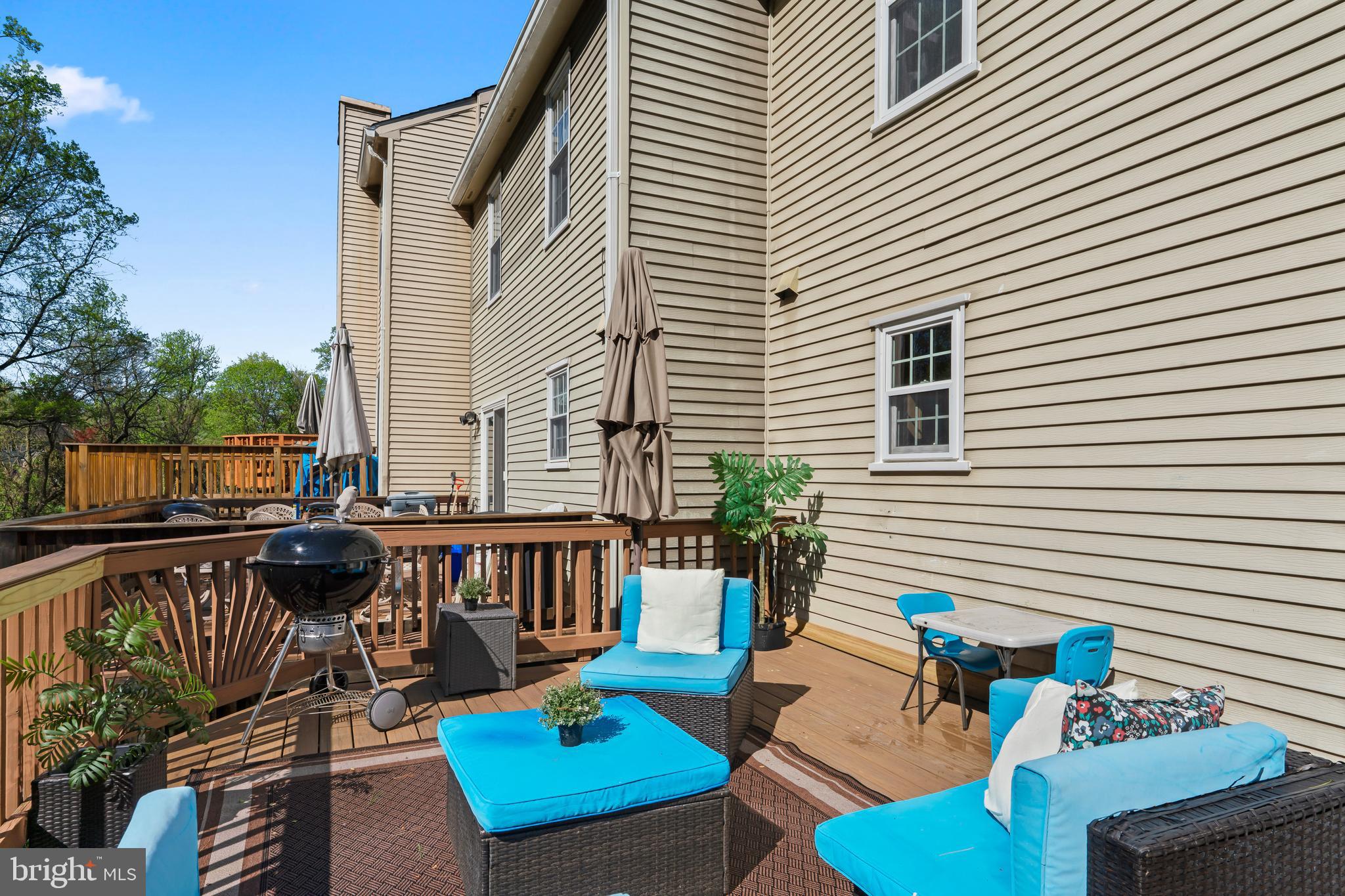 10267 Green Holly Terrace Silver Spring, MD 20902 - Photo 17 of 52 a balcony with furniture and a potted plant
