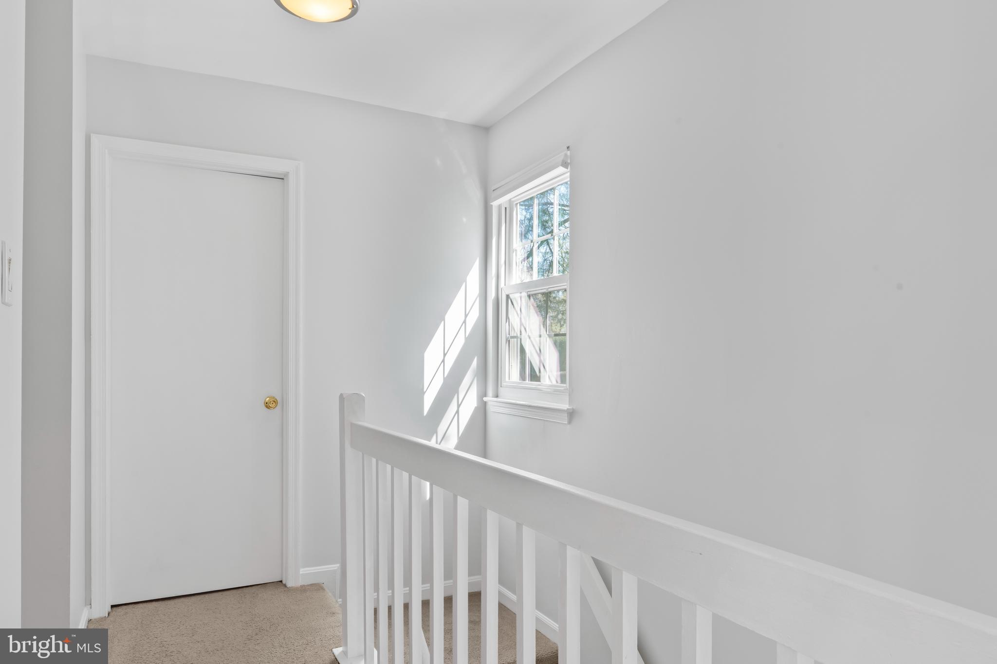 10267 Green Holly Terrace Silver Spring, MD 20902 - Photo 24 of 52 a view of a hallway with windows