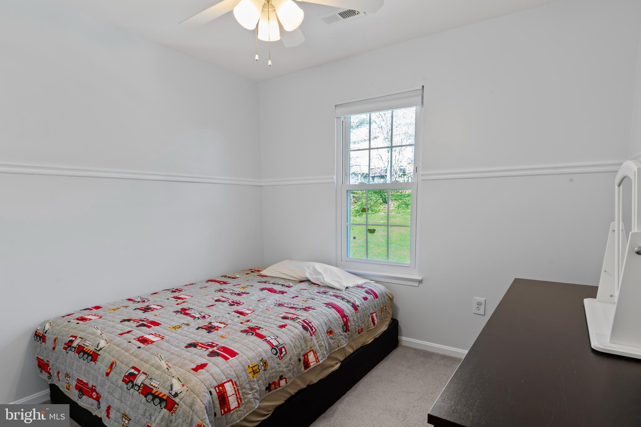 10267 Green Holly Terrace Silver Spring, MD 20902 - Photo 25 of 52 a bedroom with a bed and a window
