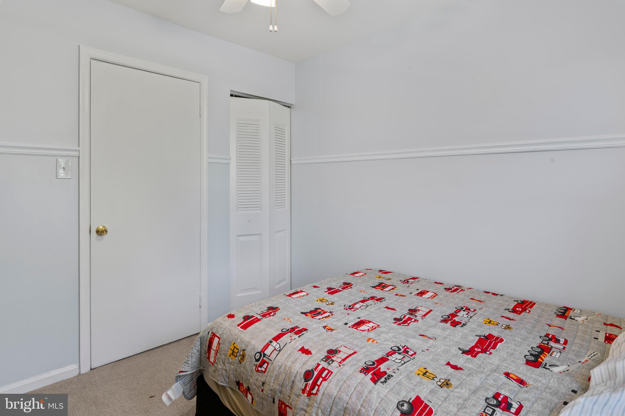 10267 Green Holly Terrace Silver Spring, MD 20902 - Photo 26 of 52 a bedroom with a bed and a cabinets