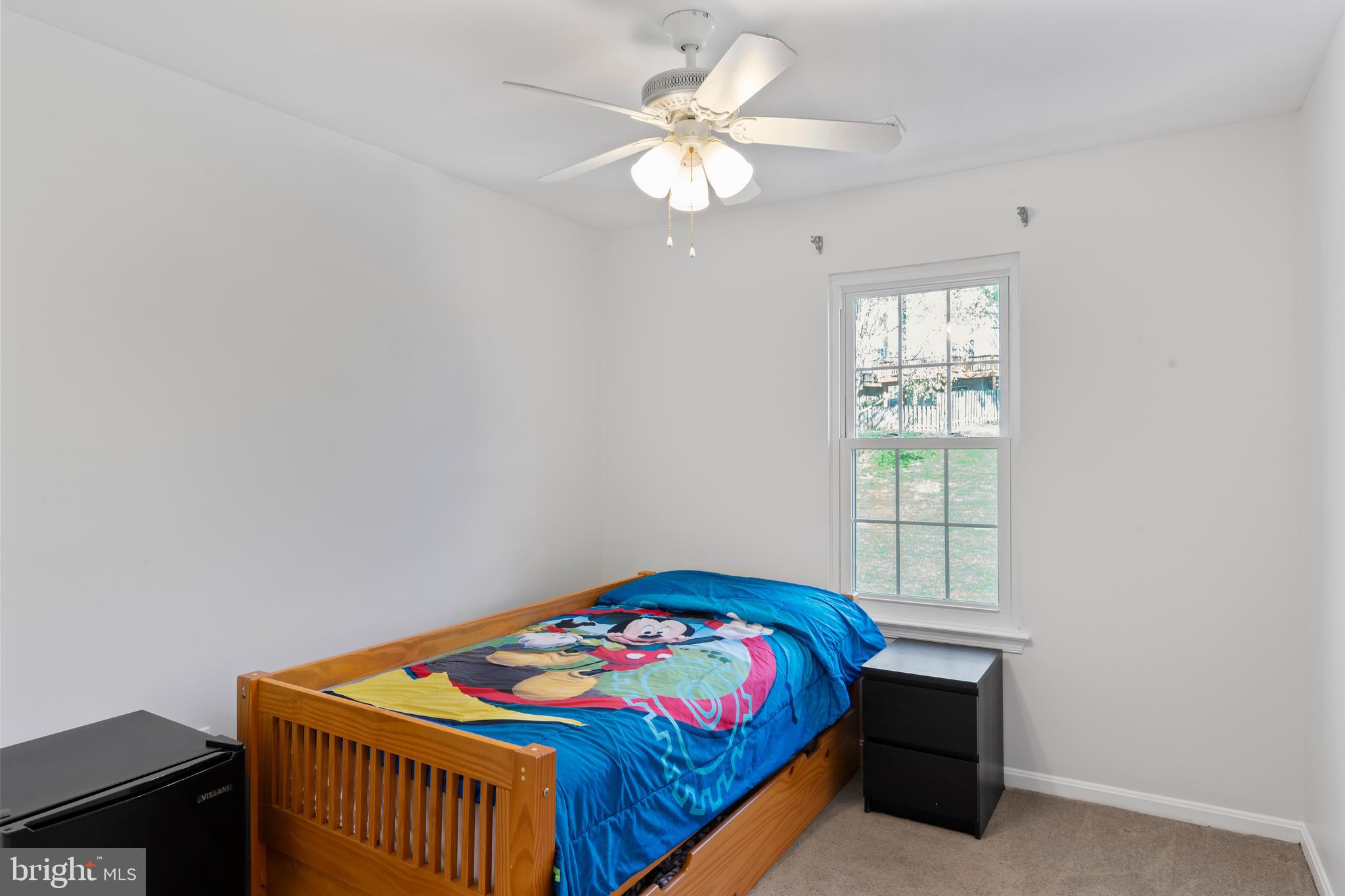 10267 Green Holly Terrace Silver Spring, MD 20902 - Photo 30 of 52 a bedroom with a bed and a window
