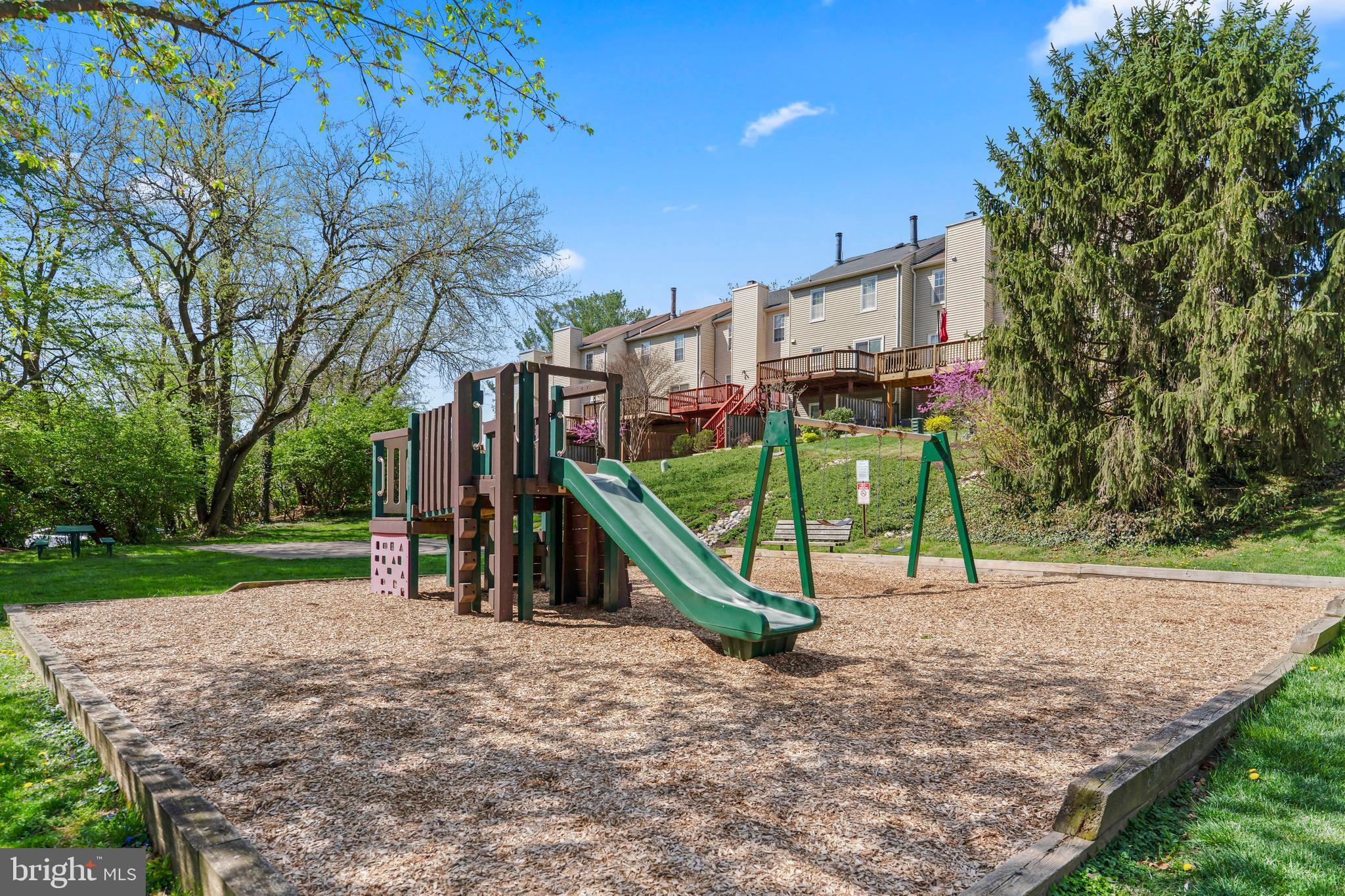 10267 Green Holly Terrace Silver Spring, MD 20902 - Photo 44 of 52 a view of a park with swings and slides