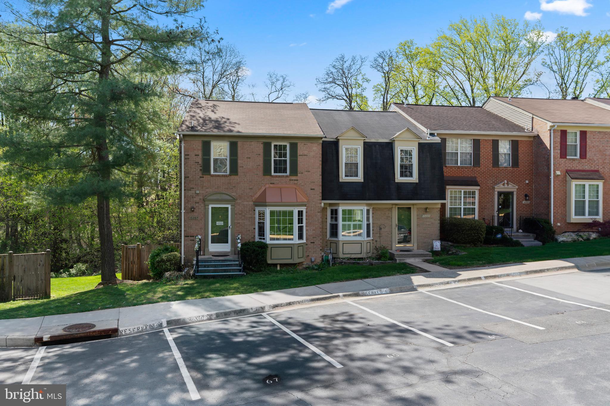 10267 Green Holly Terrace Silver Spring, MD 20902 - Photo 45 of 52 a front view of a house with garden