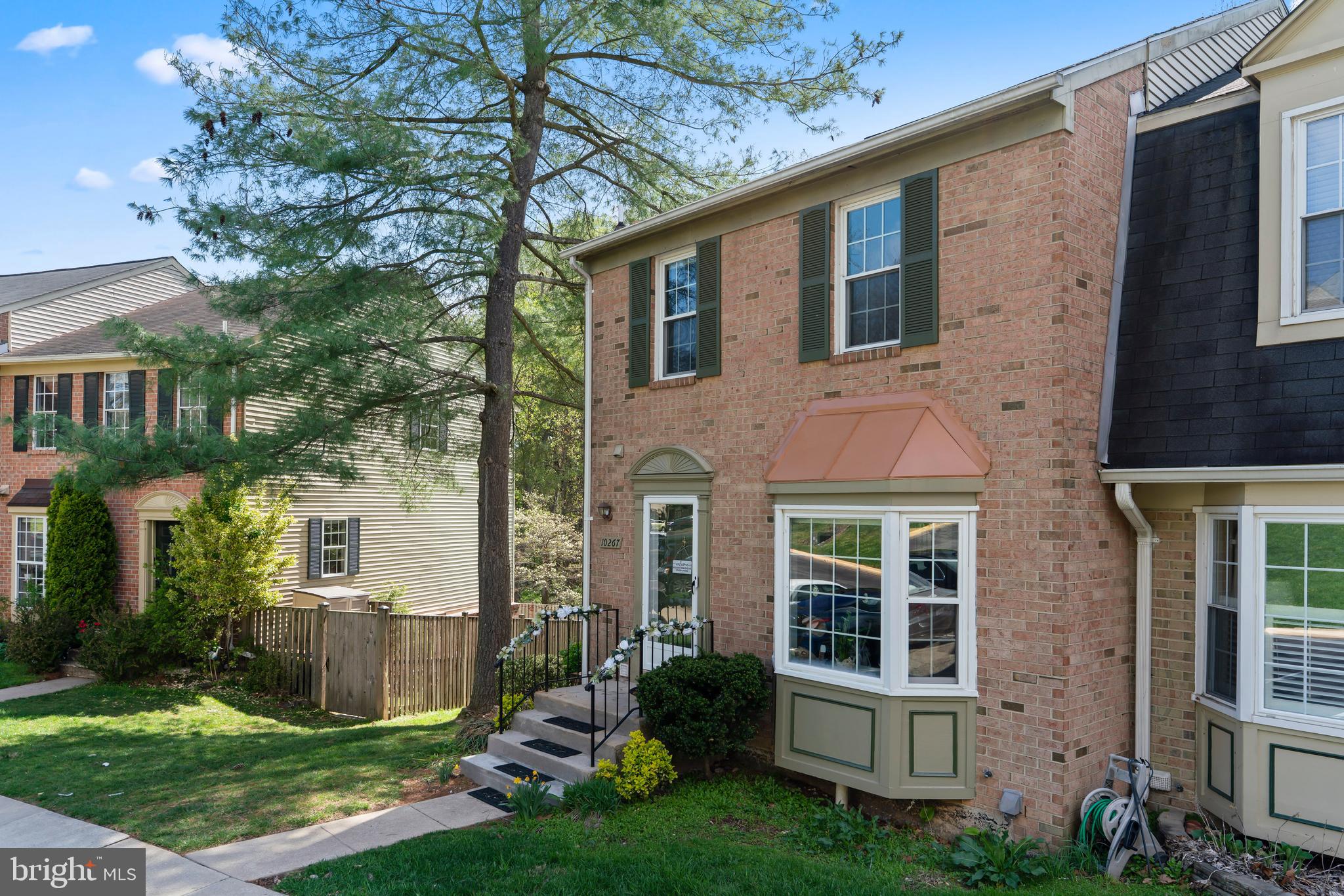 10267 Green Holly Terrace Silver Spring, MD 20902 - Photo 47 of 52 a view of a house with a yard