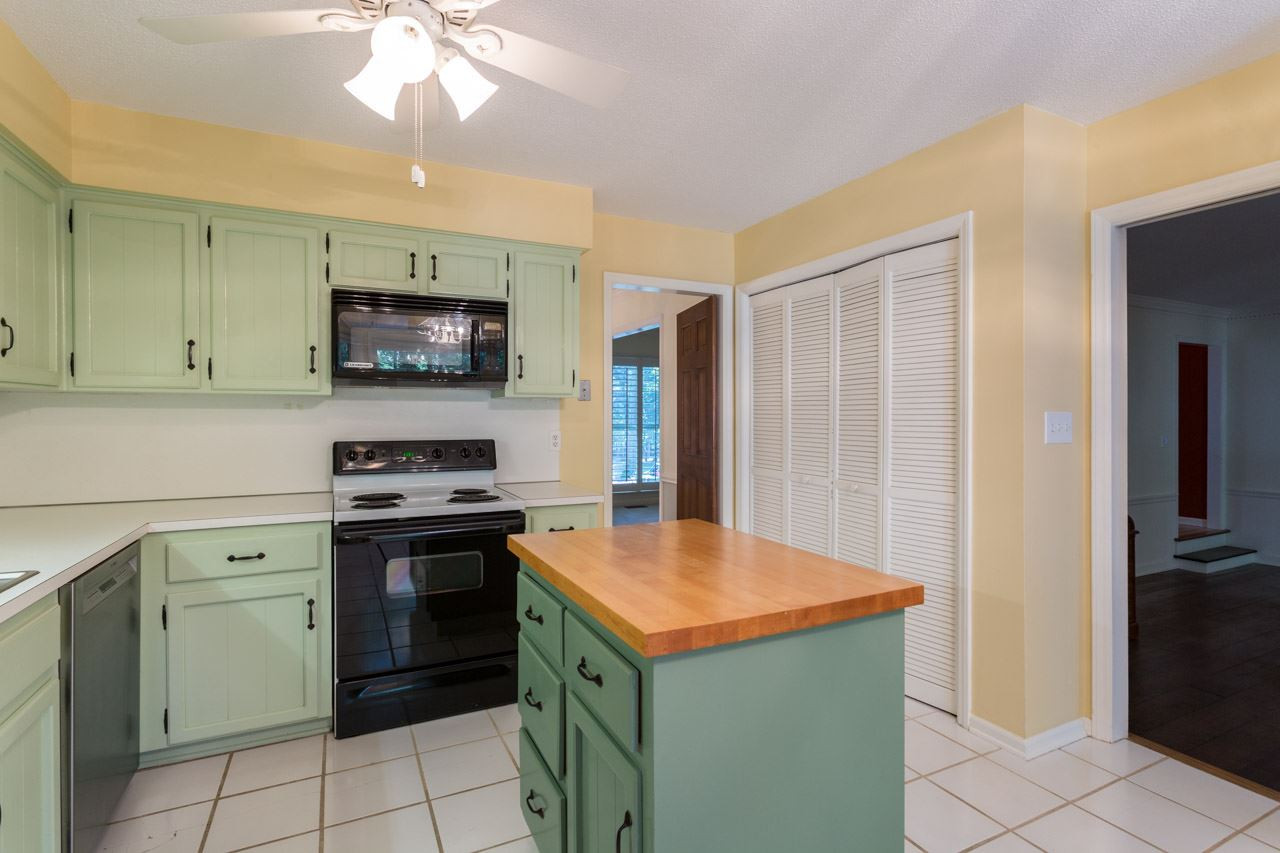 10205 Bushveld Lane Raleigh, NC 27613 - Photo 14 of 22 Island features butcher block counter top Kitchen