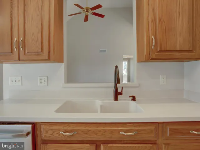 a view of room with furniture and ceiling fan