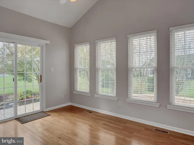 a bathroom with a bathtub and window