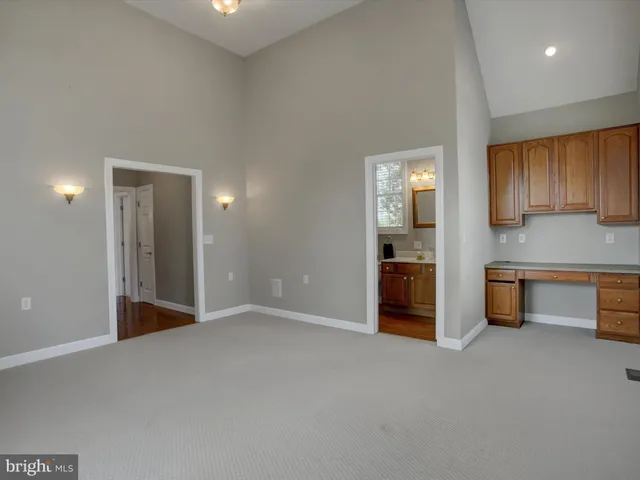a view of a room with wooden walls
