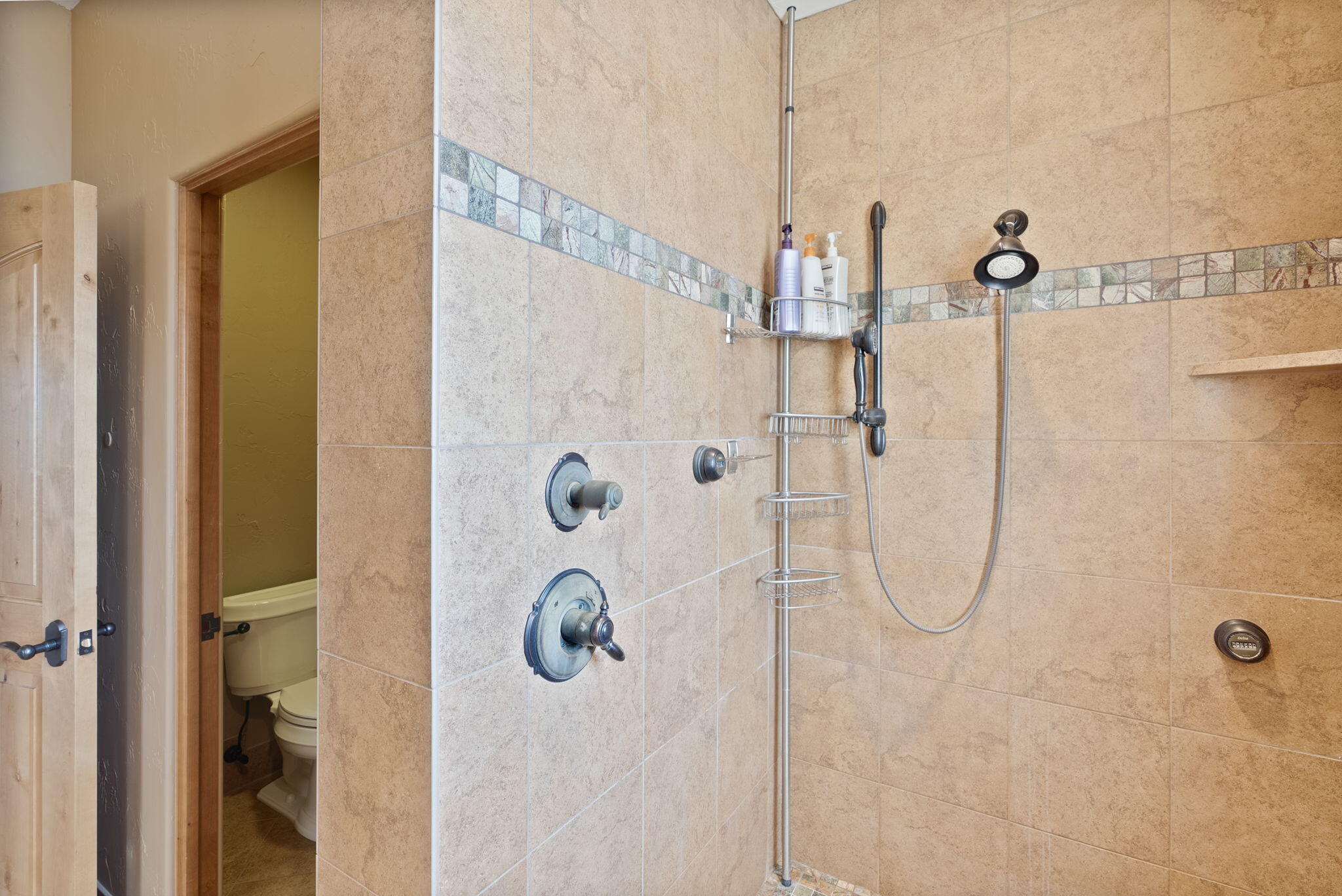 22887 Ghost Tree Lane Bend, OR 97701 - Photo 52 of 97 Fully tiled walk-in shower with custom glass door and multipe shower heads