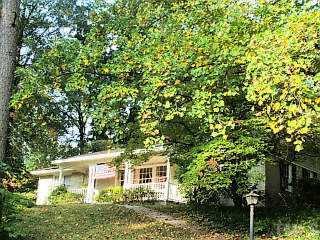 3001 Devonshire Drive Raleigh, NC 27607 - Photo 1 of 1 a view of a house with a tree