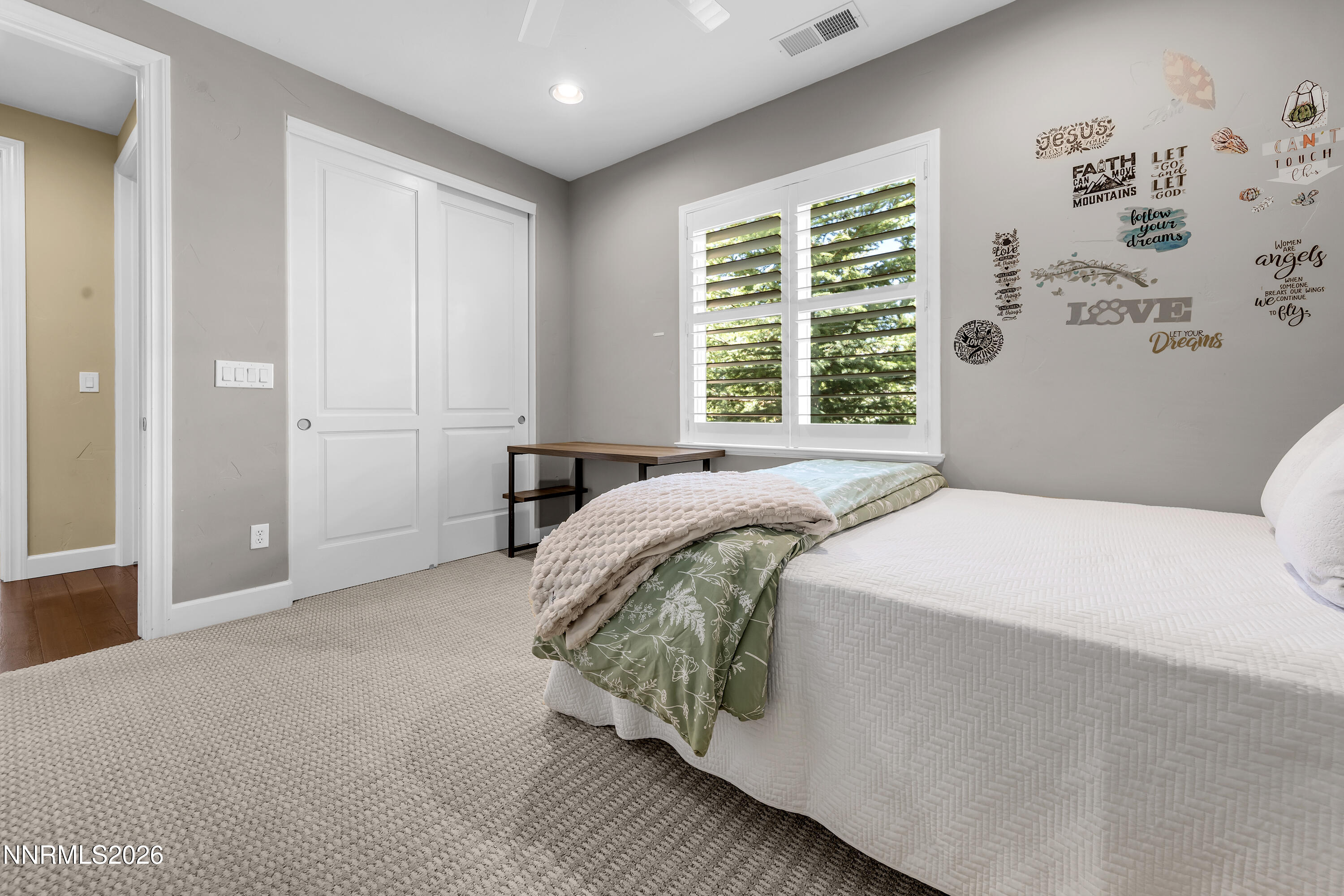 1898 Laurel Ridge Drive Reno, NV 89523 - Photo 58 of 87 a bed sitting in a bedroom next to a window