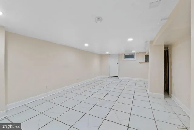 a view of an empty room and window