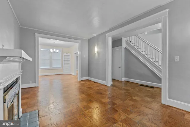 a view of an empty room with a fireplace