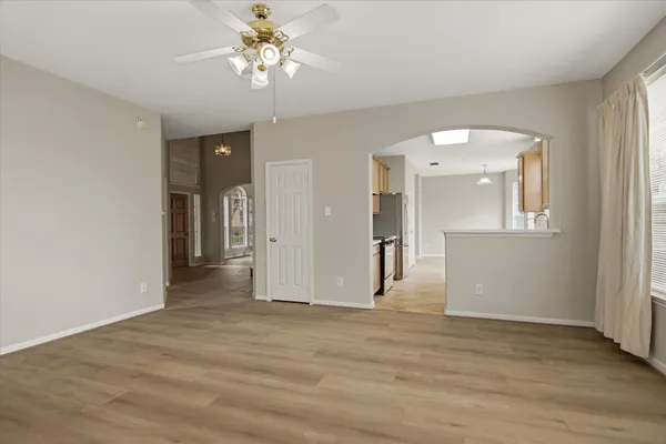 wooden floor in an empty room with a window