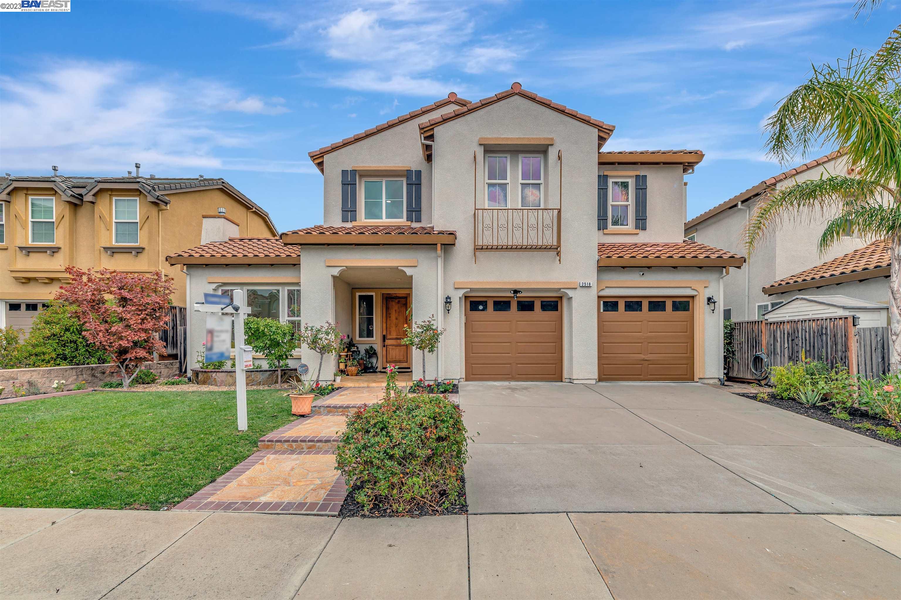 2518 Craneford Way San Ramon, CA 94582 - Photo 1 of 1 a front view of a house with a yard and potted plants